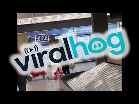 Dad Drags Daughter Through Airport || ViralHog